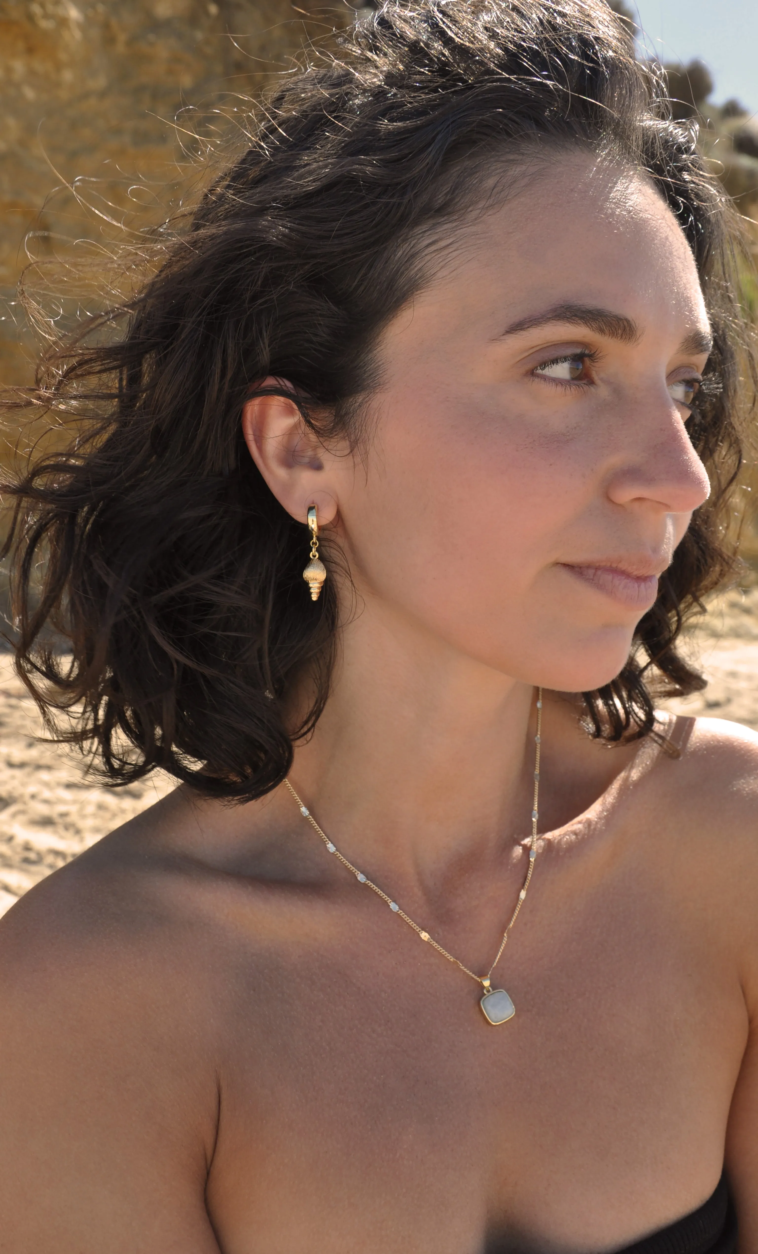 The Tunik Spiral Shell Huggie Earrings - Limited Edition